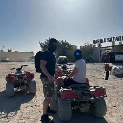Two riders on quad bikes near the Marina Safari base before departure