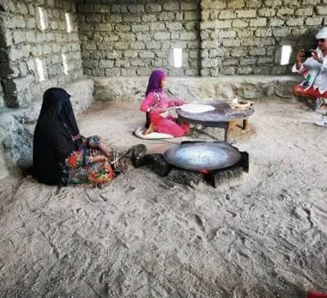 Bedouin women preparing traditional bread in the village