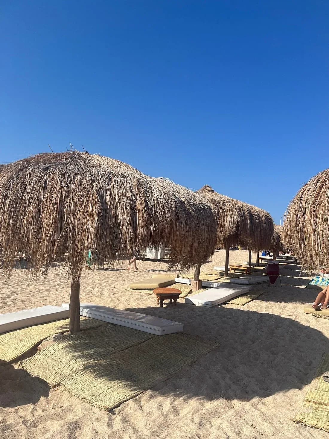 Thatched beach loungers and cabanas on Hula Hula Island