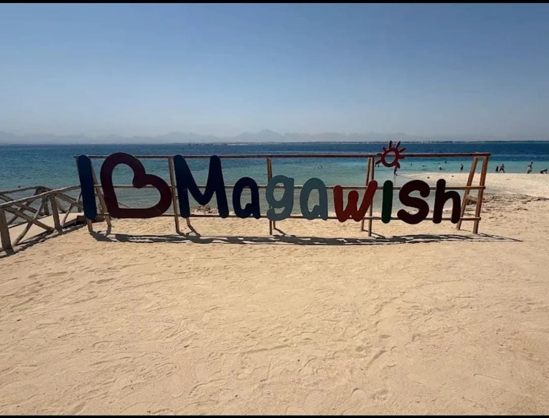 Magawish Island welcome sign, a stop on the VIP sunset cruise