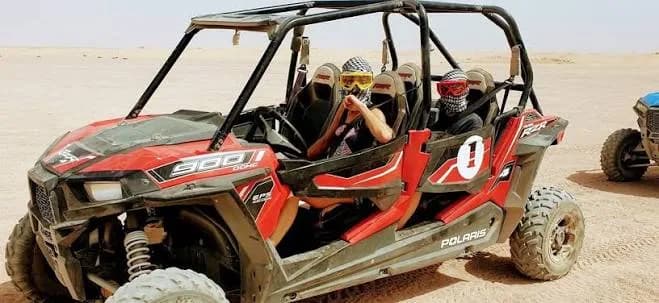 Guests riding a red buggy