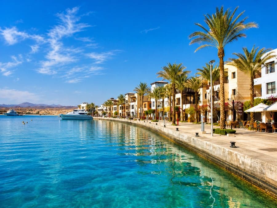 Marsa Alam marina with the Red Sea and desert mountains behind it
