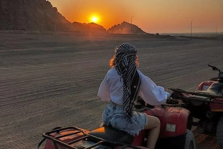 Quad rider watching the sunset over the Hurghada desert